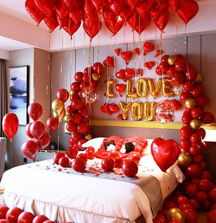 Proposal surprise decoration with candle pathway, ring pedestal and balloons in Ahmedabad